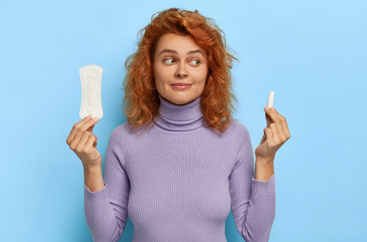 Woman Holding Sanitary Pads