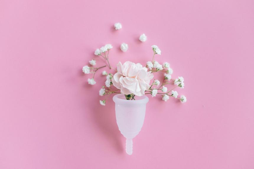 A pink flower inside a menstrual cup