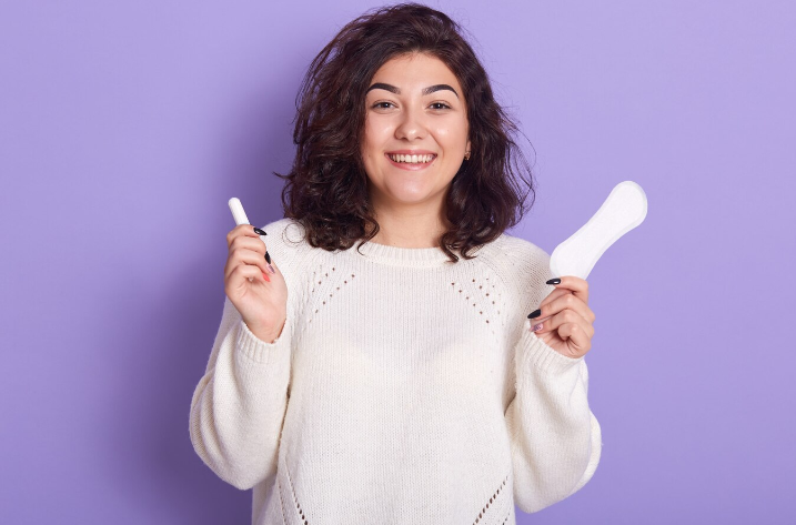 Woman Holding Sanitary Pads