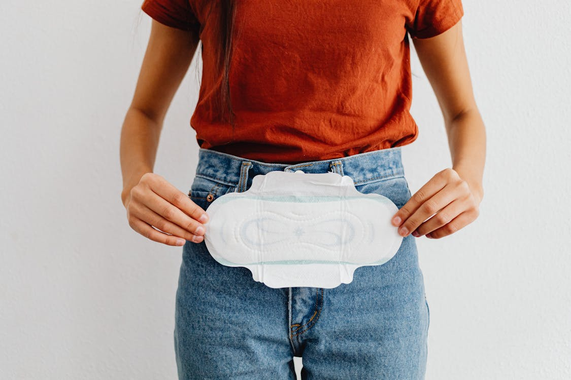 A girl holding a disposable pad