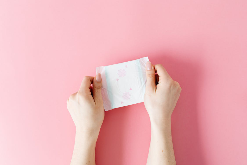 A woman holding a pad