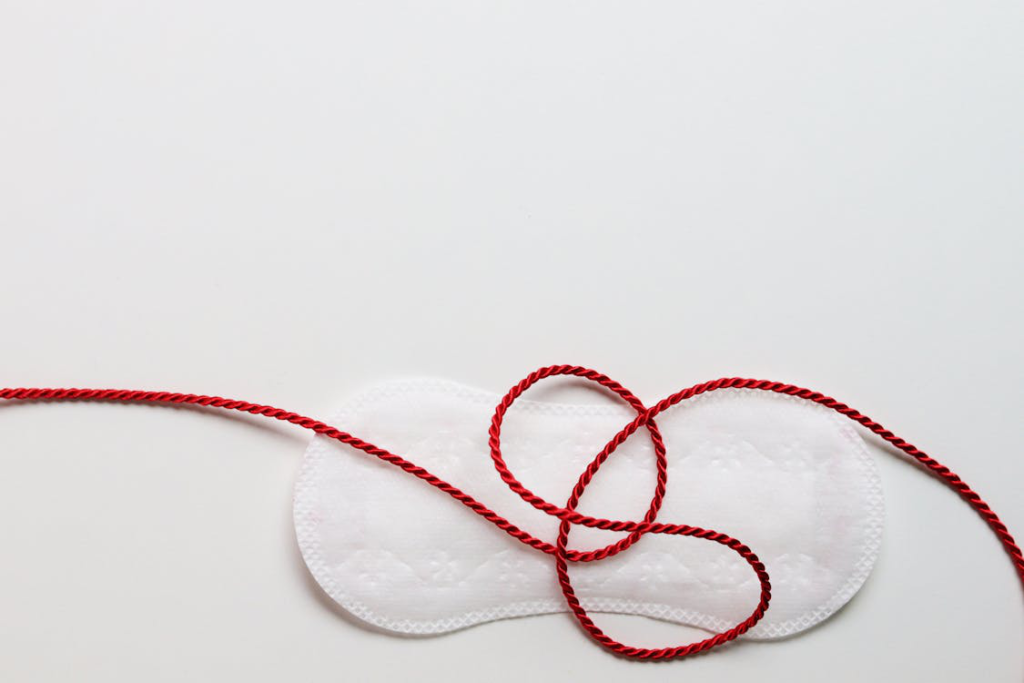 A red string placed on a pad