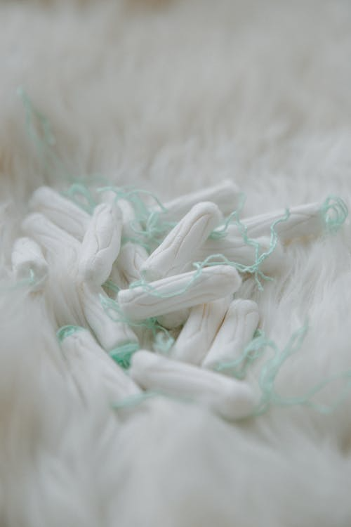 close-up of tampons on a white fur surface