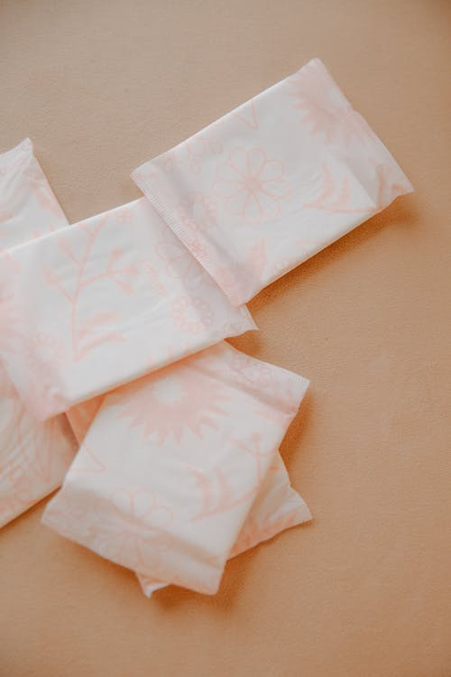 close-up of pads placed on a nude color background