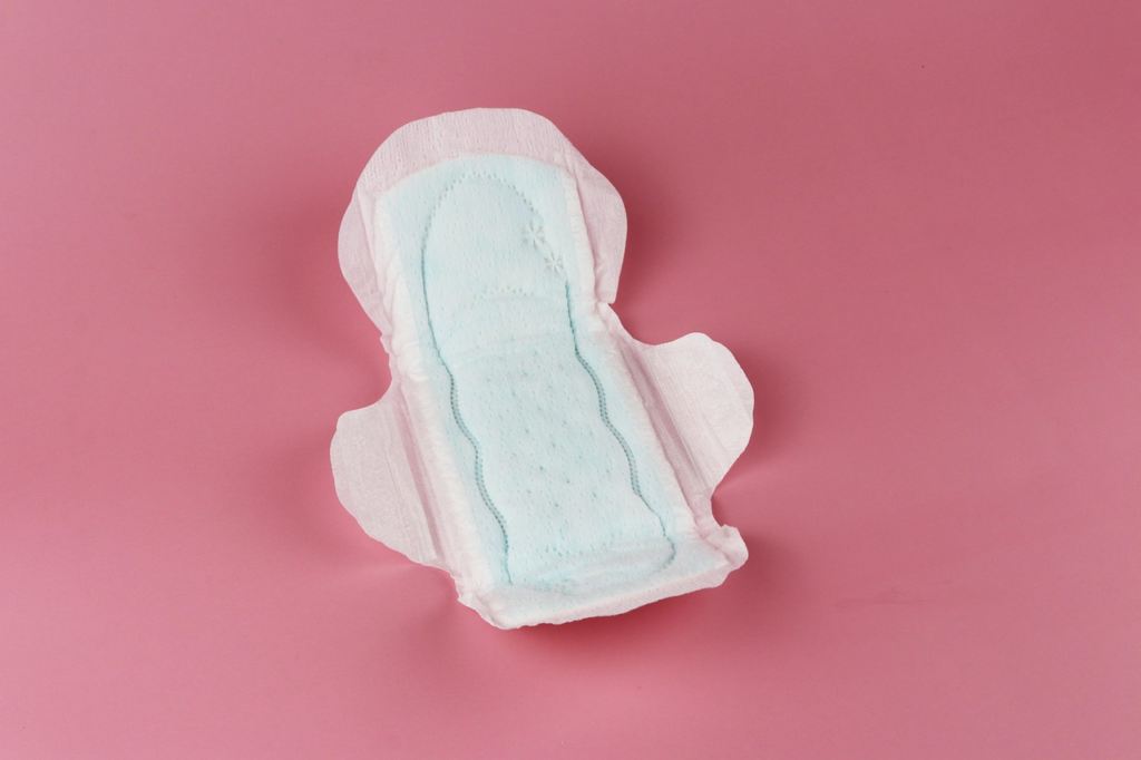 an open pad placed on a pink surface