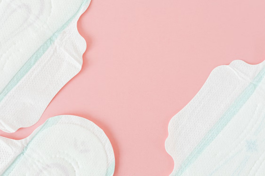  This photo shows sanitary pads on a pink surface.