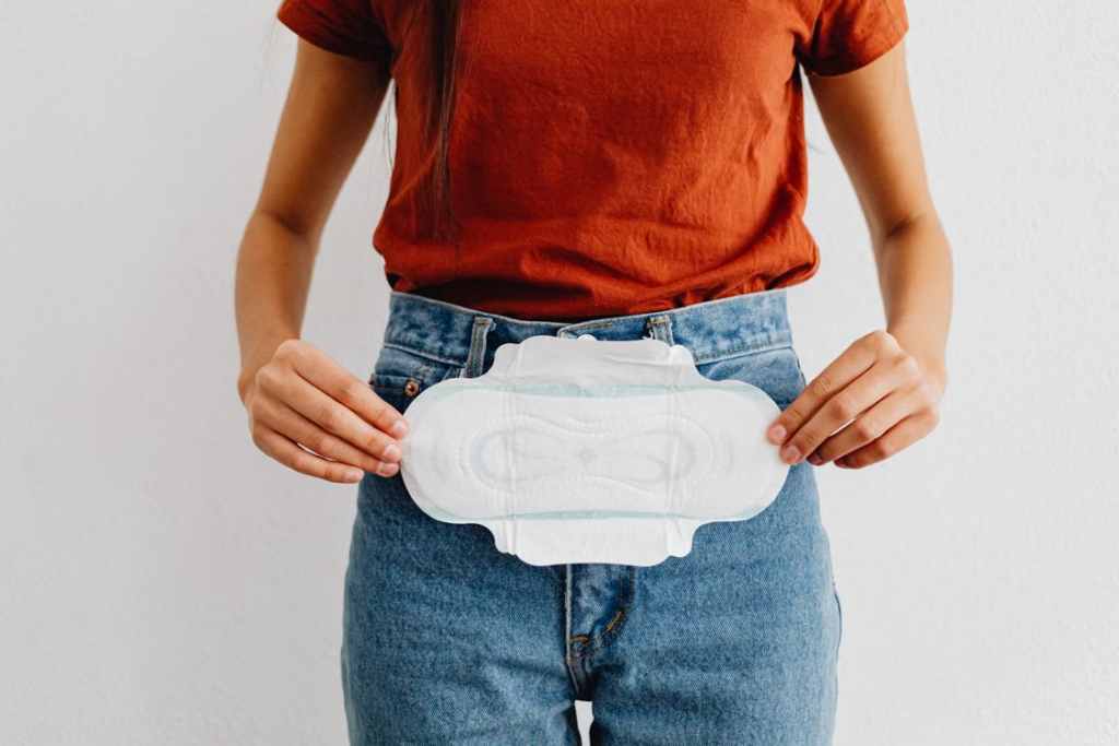 This photo shows a woman holding a sanitary pad.